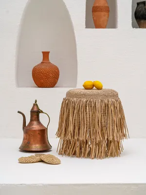 Malawian hand-knitted raffia and wooden pouf